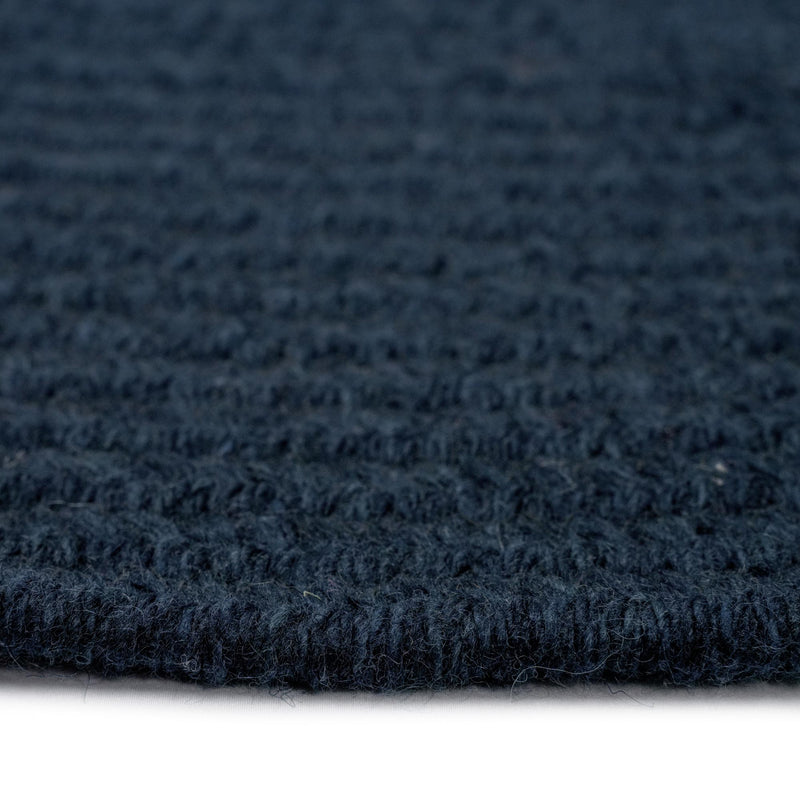 Heathered Pinwheel Navy Blue Solid Braided Rug Oval Cross Section image